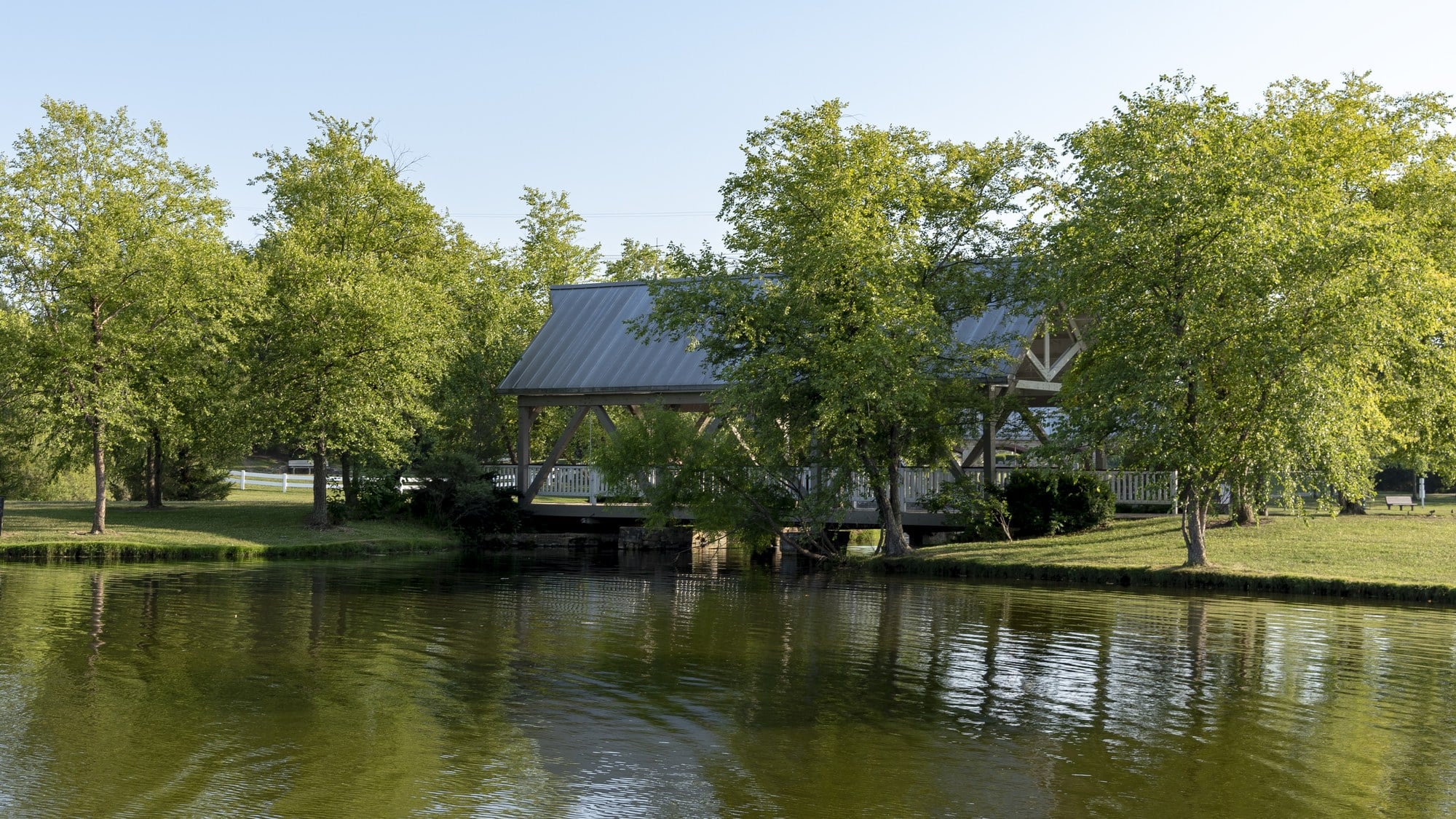 The covered bridge at Homestead Metro Park seen across the fishing pond, Hilliard