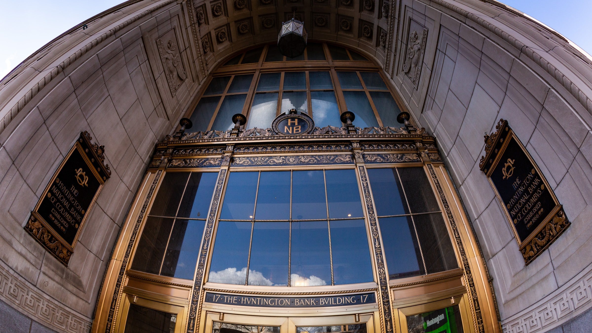 Bronze and glass High Street entrance of the Huntington National Bank Building in downtown Columbus, with the 17 Huntington Bank Building lettering over the doors