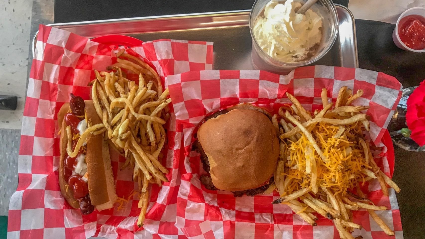 Baskets of diner food on a tray at a Columbus restaurant table