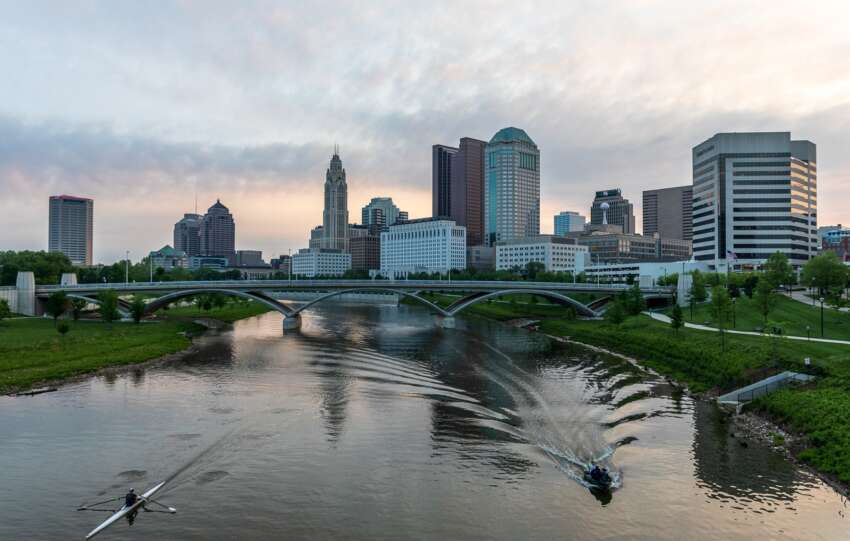 Downtown Columbus skyline from the Scioto Mile with a rower on the river