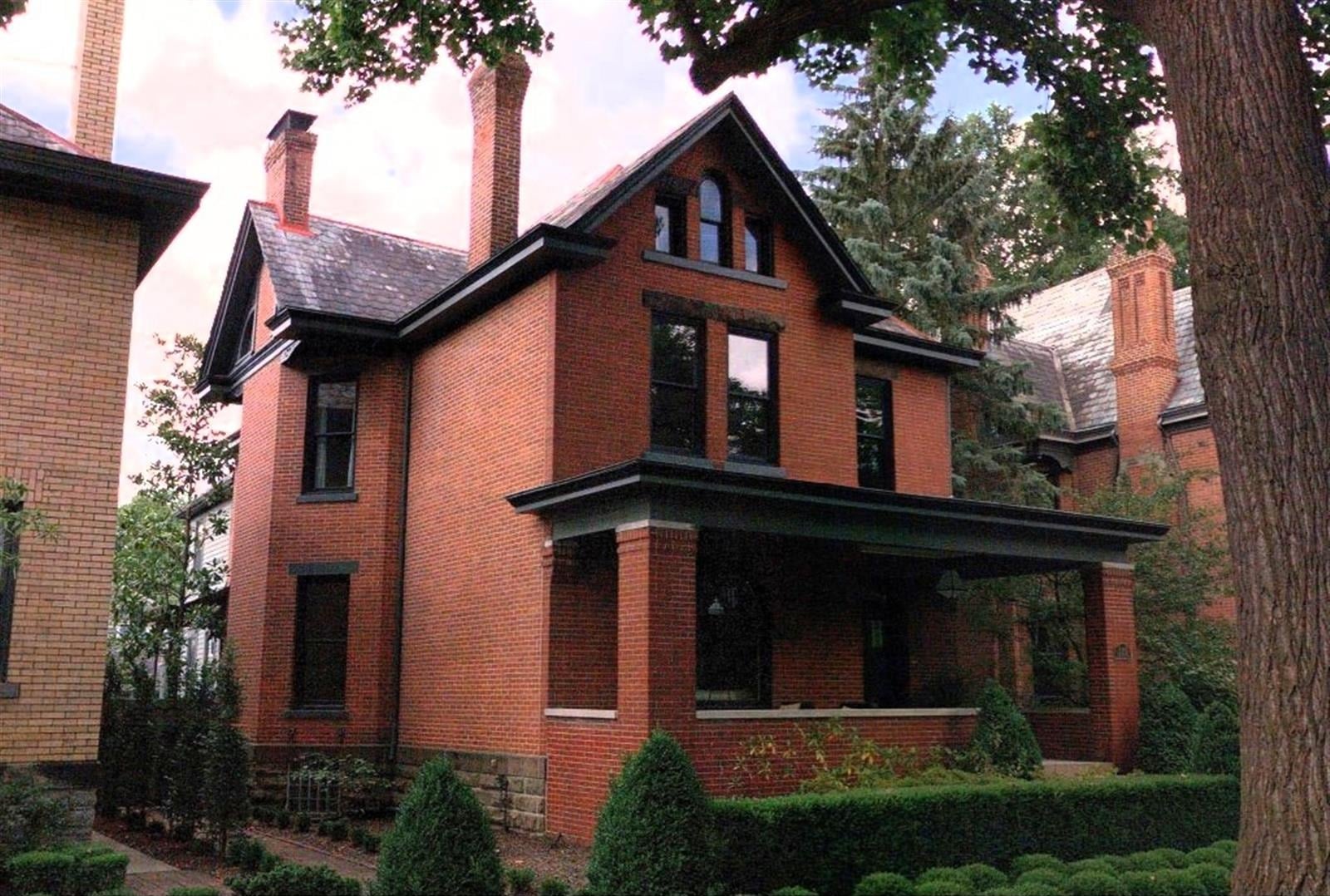 red brick victorian house with a black trimmed porch german village columbus ohio