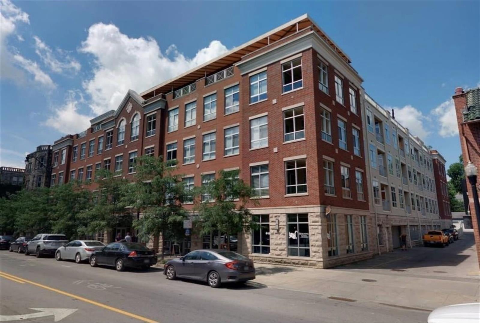 four story brick condo building on a short north corner columbus ohio