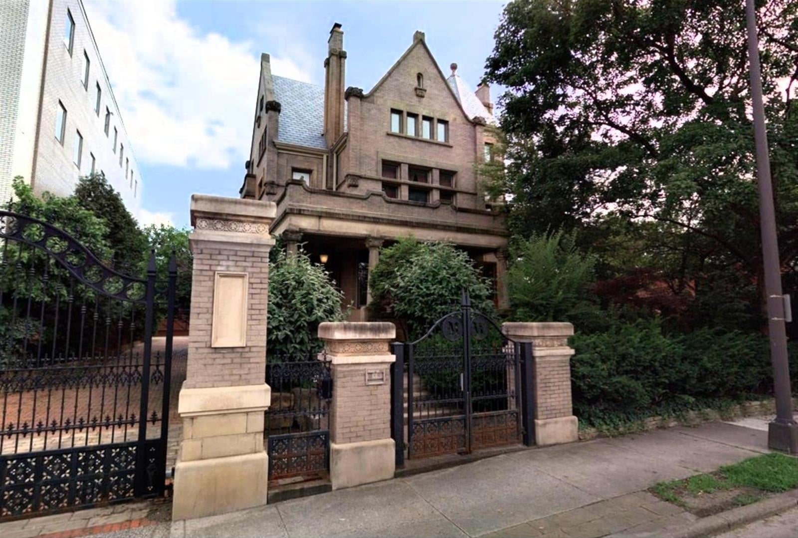 stone romanesque mansion behind an iron gate olde towne east columbus ohio