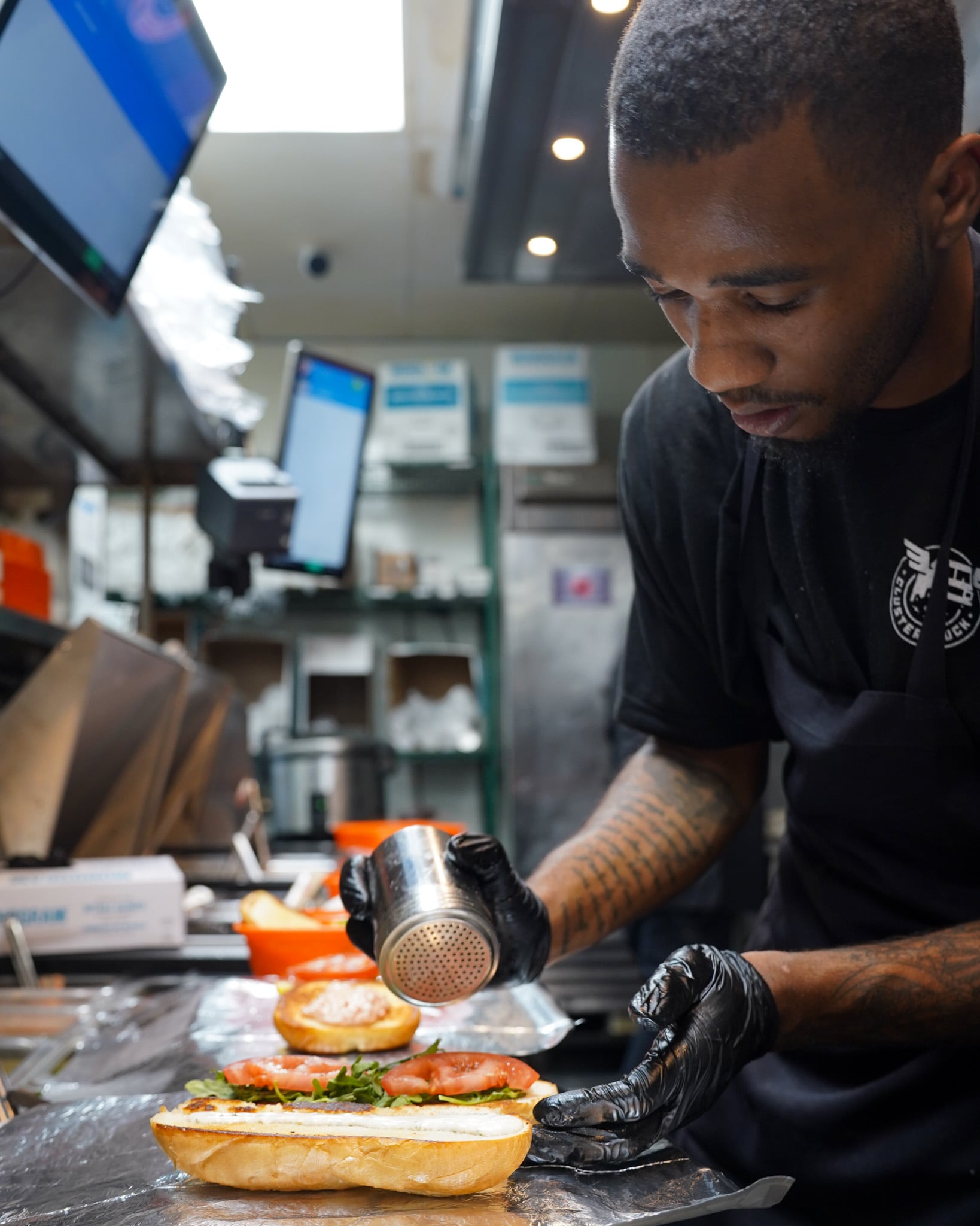 ClusterTruck Brings A Different Approach To Food Delivery In Columbus 3 person making a sub