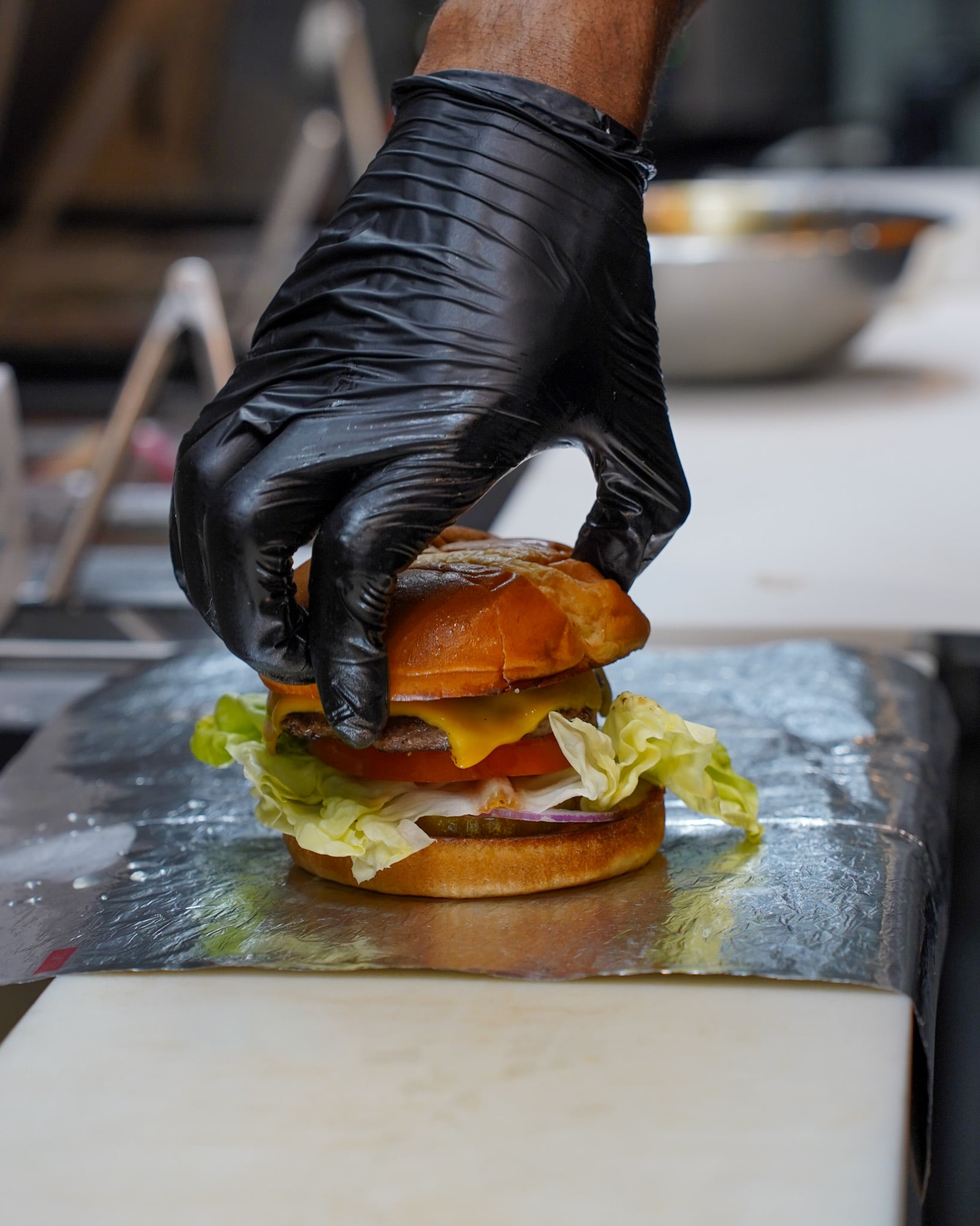 ClusterTruck Brings A Different Approach To Food Delivery In Columbus 1 person stacking burger