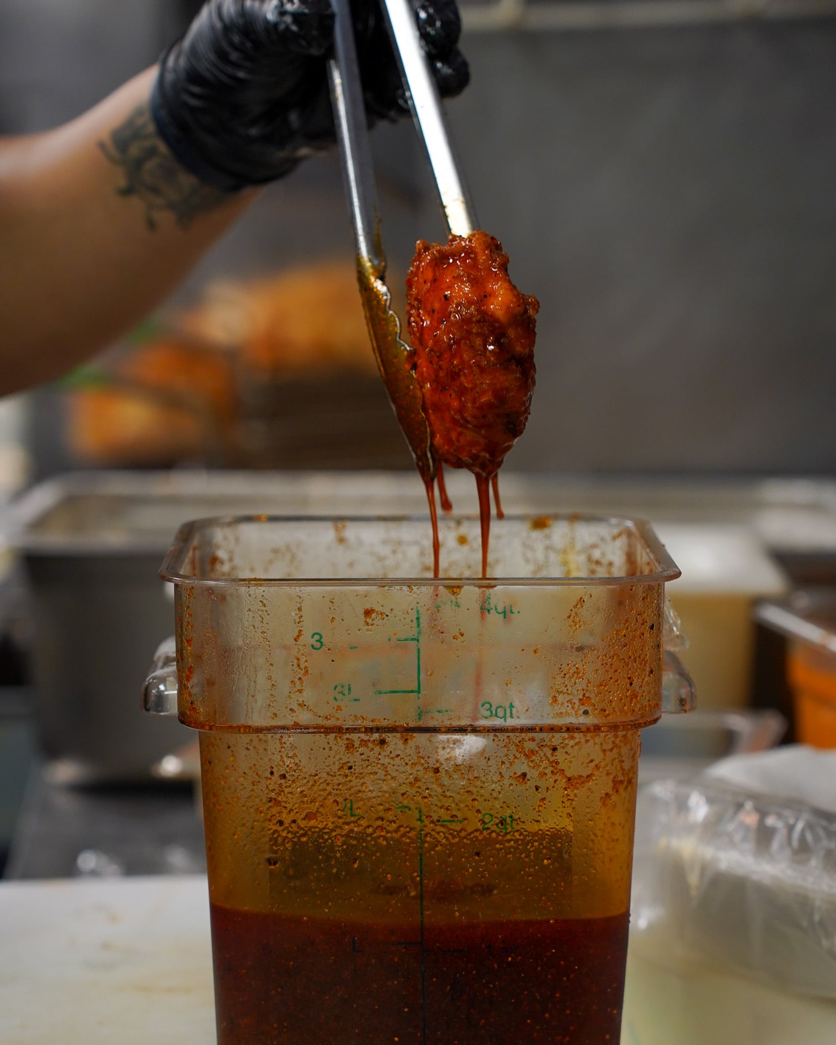 ClusterTruck Brings A Different Approach To Food Delivery In Columbus 2 chicken being dipped in hot sauce