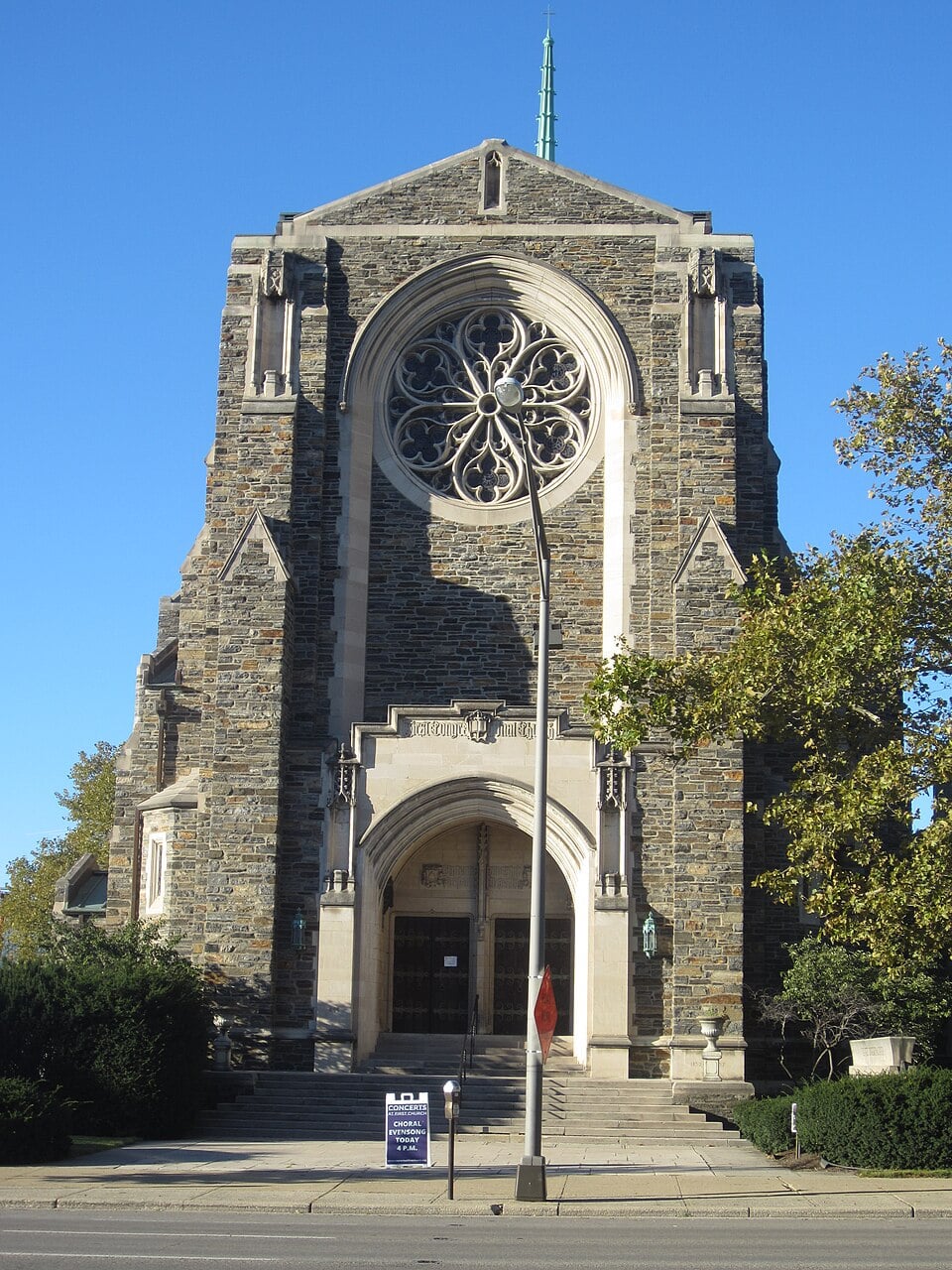 gothic church with stained glass window and arched door