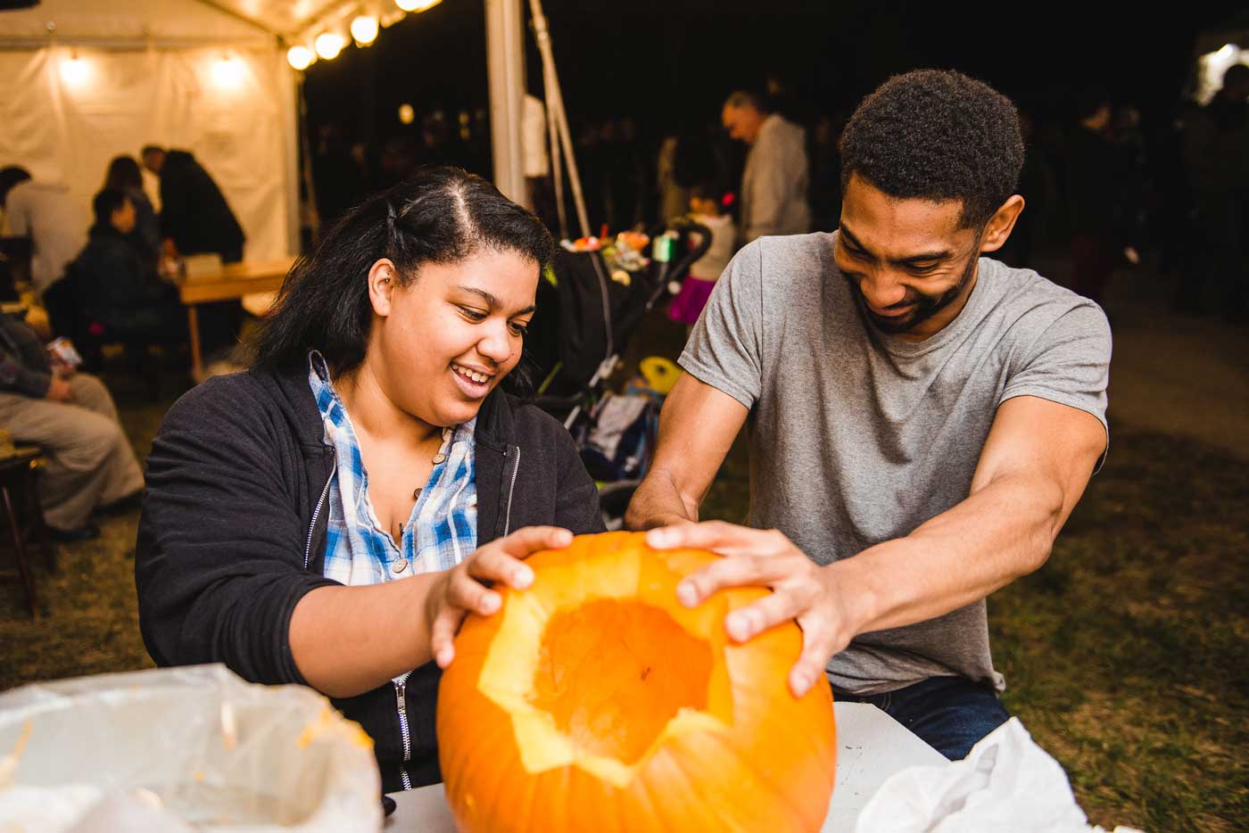 All Hallows' Eve: The Headless Horseman Is Coming Back To Ohio Village 1 people carving pumpkin