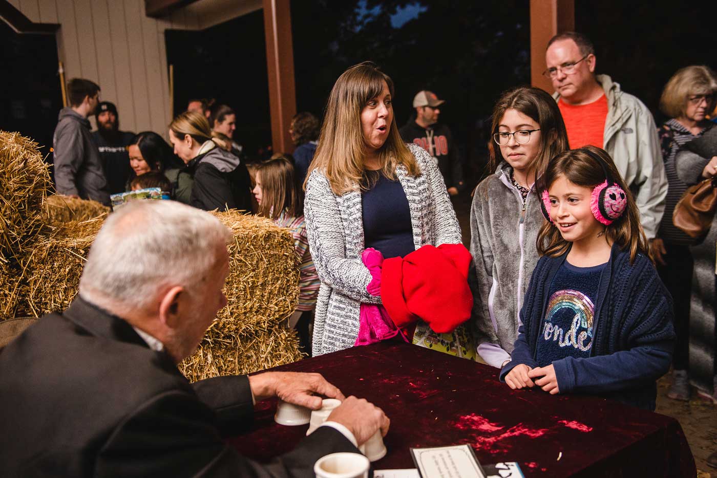 All Hallows' Eve: The Headless Horseman Is Coming Back To Ohio Village 2 family watching magician perform