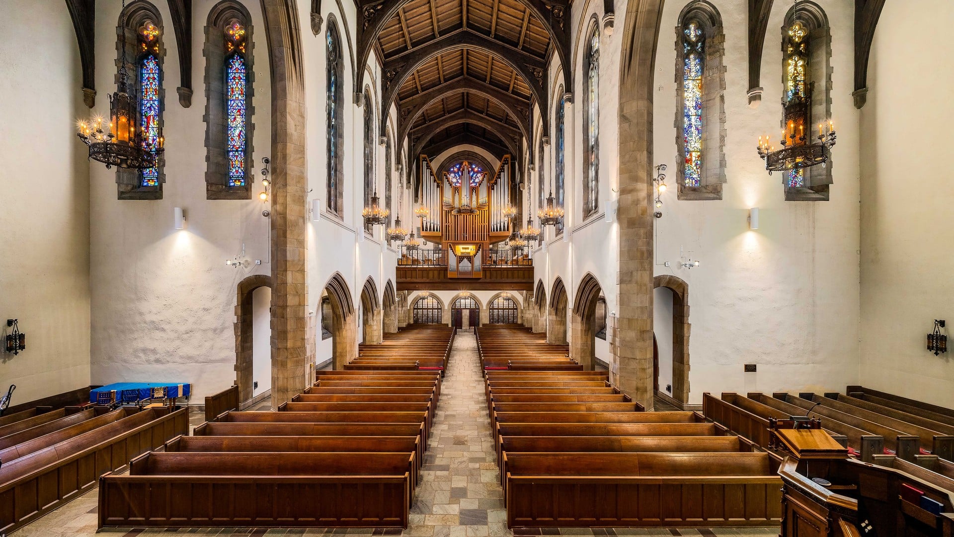 The Best Things To Do In Columbus This Weekend (October 30th–November 1st) 4 The sanctuary of First Congregational Church, looking down the nave past the wooden pews to the rear gallery organ