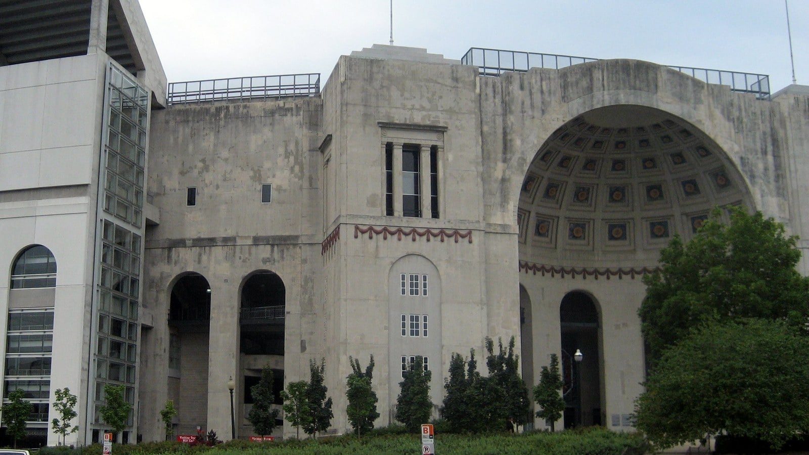 The arched concrete rotunda entrance of Ohio Stadium, with its coffered half-dome
