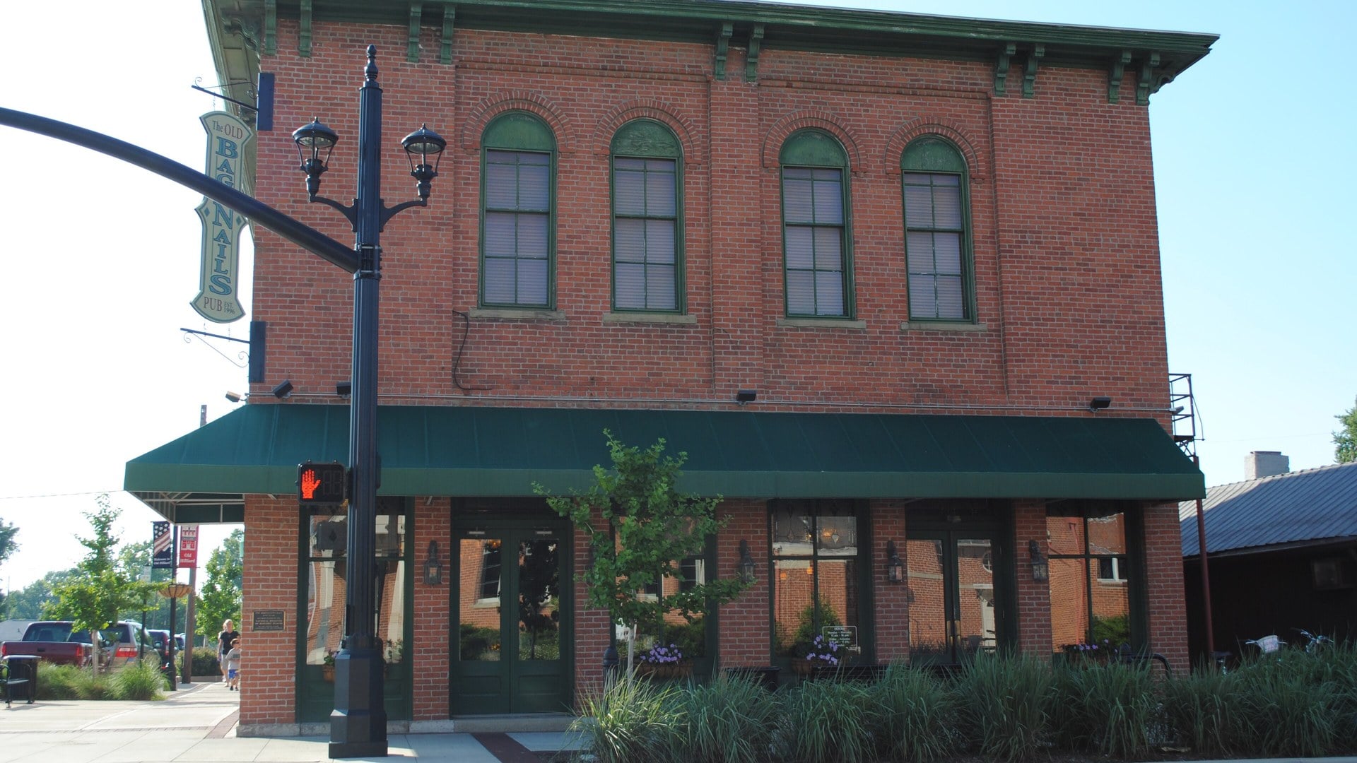 The Best Things To Do In Columbus This Weekend (October 23–25) 5 The two-story brick Odd Fellows Hall with arched windows and a green awning at a Main Street corner in Old Hilliard