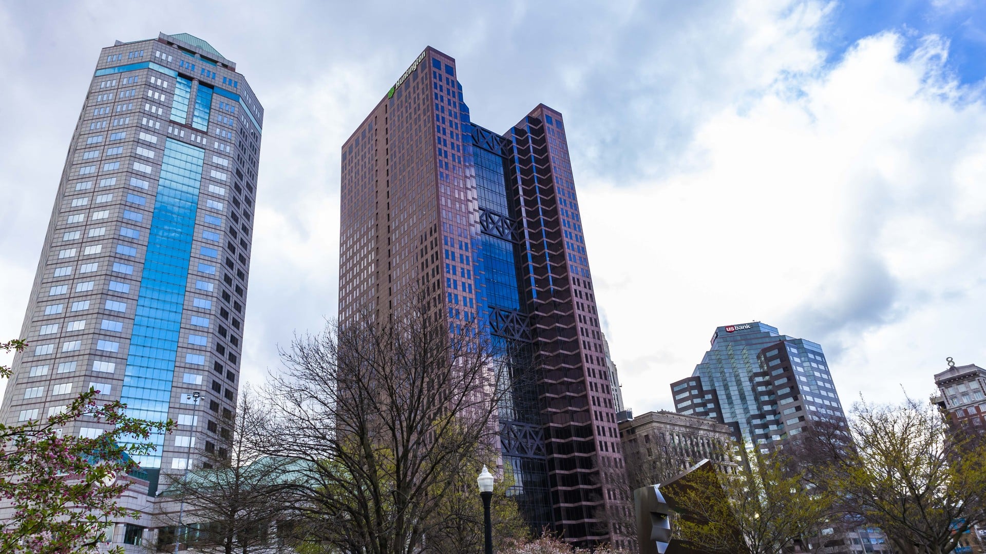 The Best Things To Do In Columbus This Weekend (October 23–25) 1 The glass towers of the Vern Riffe Center and its neighbors rising over South High Street against a cloudy sky
