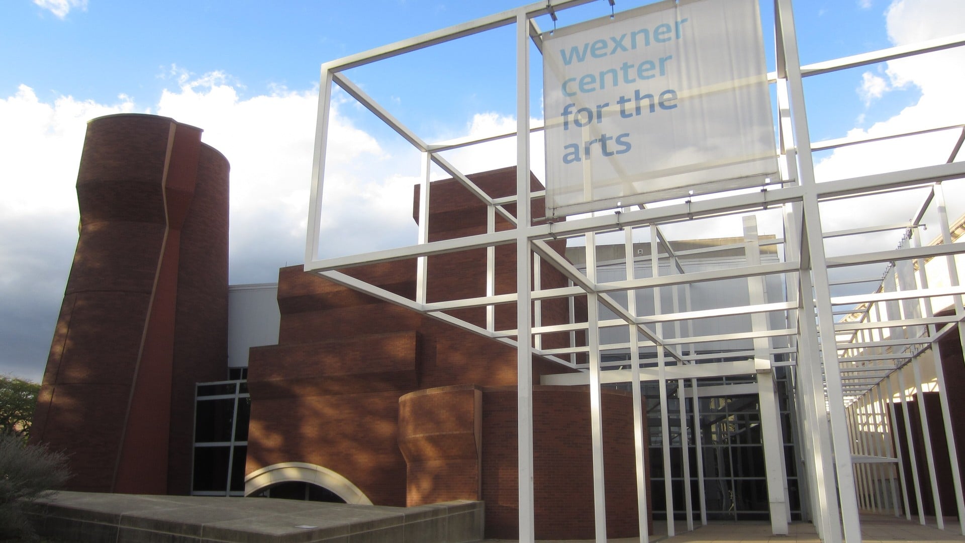 The Best Things To Do In Columbus This Weekend (October 23–25) 3 The white steel grid and Wexner Center for the Arts banner at the entrance, with the brick towers of the old Armory behind